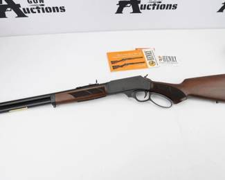 Henry Side Gate Blued/Brown Lever Action Rifle - 45-70 Government - The H010G is fairly light at seven pounds for easy game stalking, and the ventilated rubber recoil pad keeps it easy on the shoulder. The matte blued steel receiver and an 18.4? round barrel are all-business, while beautiful checkered American walnut adds the classic visual appeal that Henry made their name on. The pistol-grip buttstock and steel-capped forend come with sling swivel studs already installed so that a sling can be used for stability and muzzle rise control. The side-loading gate makes reloading and topping off the four-shot tubular magazine quick and easy without losing your sight picture. For quick and safe unloading without cycling cartridges through the action, the rifle also retains Henry's original front-loading option. The rifle is in like new condition and comes with the factory box. 