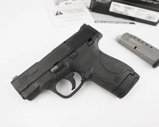 Make: Smith & Wesson
Model: M&P 9 SHEILD
Caliber: 9MM
Action: Semi
Barrel: 4
Bore: Shiny
Serial # JNY7930
Condition: Excellent
Smith & Wesson's popular M&P Shield Semi-Auto Pistol operates with a striker-fired action, eliminating any external hammer to catch on clothing when this handgun is concealed. The thin 1" profile aids with concealment. The operation is based on a polymer frame and coated stainless steel action. Other features of the S&W M&P Shield pistol are white dot rear and front sights, 2-piece trigger, textured grip, extended magazine that increases grip surface, and rounded features to make the handgun more concealed carry. Chambered in 9mm, this pistol is in excellent condition, showing minimal signs of use and wear. 