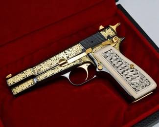 This Browning American Eagle Renaissance Hi-Power commemorative was issued in 1995 to honor American Freedom. One of only 750 produced worldwide by Fabrique Nationale in Belgium and assembled in Portugal, this Hi-Power is adorned with 24 karat selective plating in a lovely oak tree design with an American Eagle emblem on the top of the slide. The white plastic grips also present an oak leaf design. This pistol is in Excellent condition, exhibiting almost no signs of handling and retaining 99% of its metal finish. It is equipped with one 10-round magazine and comes in its original Browning case with a Certificate of Authenticity and original Browning Owner’s Manual. The American Eagle Renaissance Hi-Power commemorative is a striking tribute to American Freedom and a wonderful collectors’ piece. The pistol is in excellent condition showing minimal signs of use and wear. The firearm comes with one magazine and a display box.