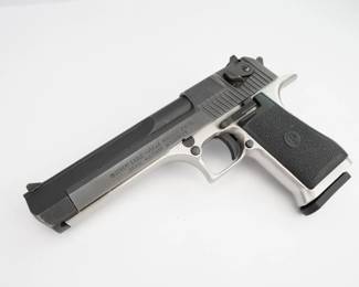 Make: Israel Military Industrie
Model: Desert Eagle
Caliber: .41/44
Action: Semi
Barrel: 6
Bore: Shiny
Serial # 52101-S
Condition: Excellent
The Desert Eagle is a semi-automatic pistol known for chambering the largest centerfire cartridge of any magazine-fed, self-loading pistol. It is regarded as a pistol with high stopping power. Magnum Research Inc. (MRI) designed and developed the Desert Eagle. The design was refined and the pistols were manufactured by Israel Military Industries (IMI) until 1995, when MRI shifted the manufacturing contract to Saco Defense in Saco, Maine. In 1998, MRI moved manufacturing back to IMI, which later commercialized its small arms branch under the name Israel Weapon Industries. This Desert Eagle is chambered in the less common .41/44 Mag and features a 6” barrel and one magazine. The pistol is in excellent condition, showing minimal signs of use and wear. 