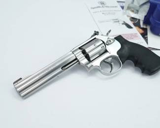 Make: Smith & Wesson
Model: 617-5
Caliber: .22lr
Action: DA
Barrel: 6
Bore: Shiny
Serial # DAJ2904
Condition: Excellent
The Smith & Wesson model 617 revolver in .22 LR caliber, is based upon the previous model 17, that’s no longer produced, improved by using stainless steel instead of the standard blued carbon steel. This 617-5 is outfitted with rubber S&W grips, a ramp front sight with adjustable rear, a 6 round cylinder, and the factory blue hard case. The revolver is in excellent condition,showing minimal signs of use and wear.