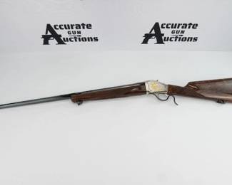 This Browning 1885 is a single shot rifle chambered in 7mm Rem Mag. It is a Special Limited Edition of the Year 2000 Banquet Rifle of Rocky Mountain Elk Foundation. This is number 225 of 425 in 7mm Rem Mag caliber. Octagon 29" barrel with deep rich colored blueing, with gold letter engraving on both sides. Silver colored receiver which has gold Bull Elk engraved in scenes on both sides of the receiver to make this a very elegant appearing rifle. Wood stock and forearm is from select high grade walnut with fantastic feather crotch grain showing throughout. The rifle is in excellent condition