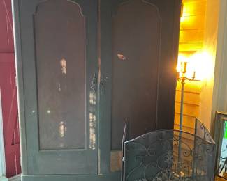 Large early Southern Empire mahogany armoire with wrought iron fire screen