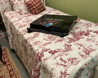 Twin wrought iron bed with twole bedspread
