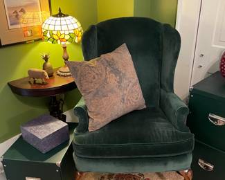 Mahogany wingback with velvet upholstery and leaded glass table lamp