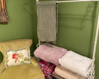 Wrought iron clothes rack and the chair