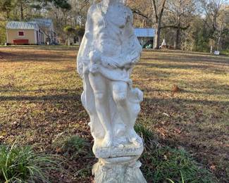 Old life size concrete statue with pedestal