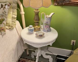 White distressed table with painted china items