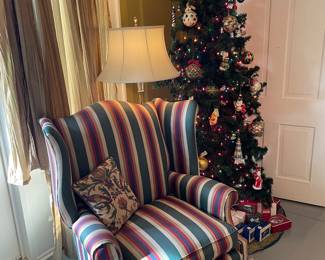 Charles Stewart Chippendale wingback with Christmas tree of Waterford and Christopher Radko ornaments