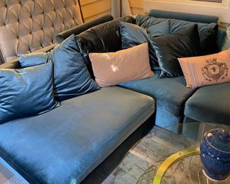 Detail of sectional with twin French linen upholstered headboard