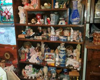 She shelf stays with the house (items within are for sale)