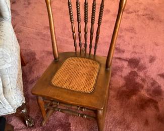 Cane bottom chair in living room 