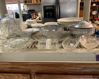 Glass bowls & platters - some Fostoria mixed in along with silver top bowl & aluminum server with lid
