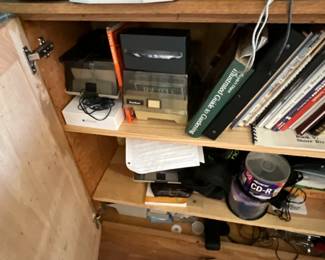 Cabinet full of books & computer equipment & accessories 