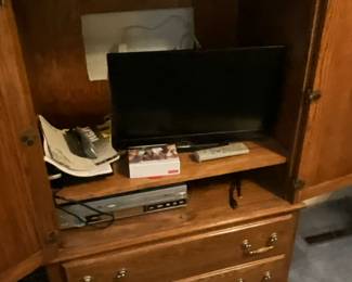 Armoire with VHS player & HDMI DVD player and screen in master bedroom 