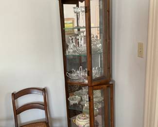 Living room glass front cabinet & cane bottom chair