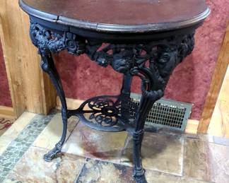 Antique Cast Iron Pub Table With Wood Top And Ram's Head Accents, 29.5" x 26"