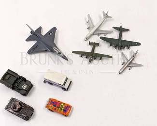 (9) TOY CARS/PLANES
(1) ERTL DIECAST FIGHTER JET, 6.5'' X 4.5''
(1)BRONZE COLORED TANK PENCIL SHARPENER, 2.75'' X 1.25''
(1) SOLIDO MILITARY JEEP 4X4, 3.25'' X 1.25''
(1) 1976 HOT WHEELS USPS VAN, 2.75'' X 1''
(1) 1977 HOT WHEELS PACER CAR, 2.5'' X 1''
(4) TOY PLANES (PLASTIC), 3.25'' - 4.5''