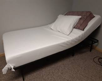 Basement bedroom,  twin foam bed with folding metal base.  Comfy.