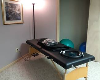 Folding massage table.