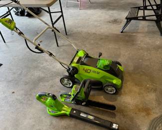 Green works 16" electric mower, leaf blower and chain selling as a set with one battery and charger