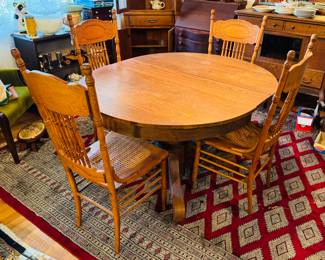 #8 - $350 - Round oak table with four chairs 2 need re caned or put a pillow on top - 45"D round + 1 leave for oval 