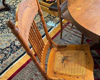 #8 - $350 - Round oak table with four chairs 2 need re caned or put a pillow on top - 45"D round + 1 leave for oval 