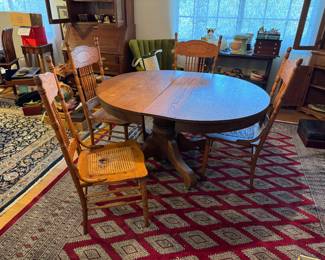 #8 - $350 - Round oak table with four chairs 2 need re caned or put a pillow on top - 45"D round + 1 leave for oval 