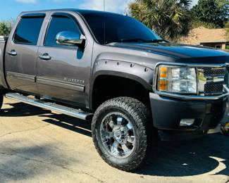 2010 Chevy Silverado LTZ Rocky Ridge Pkg - Vin 3GCRKTE29AG216598. V8. 6.2 liter. K1500. 4WD. Dark Grey. 6" lift provided by Rocky Ridge. Sliding moon roof.  Sliding back window. Real full size spare tire. Warn winch mounted on the brush guard. Tool box. Heavy duty rear axel. Premium stereo system. DVD players in the back of seats. Back up Camera. Super clean interior. High speed wheel alignment done at Baughn alignment, New Shocks, new tie rods, new ball joints on front end & new brakes. $21,700 or Best offer
