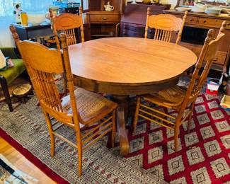 #8 - $350 - Round oak table with four chairs 2 need re caned or put a pillow on top - 45"D round + 1 leave for oval 