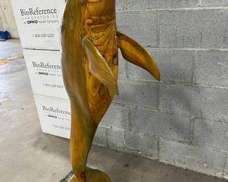 Tall carved wood dolphin