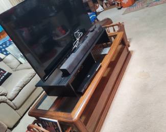 Flat Screen TV, Sound Bar, Coffee Table