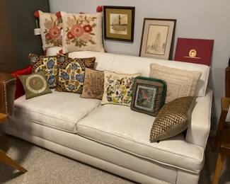MCM leather sofa, decorative pillows, West Texas art