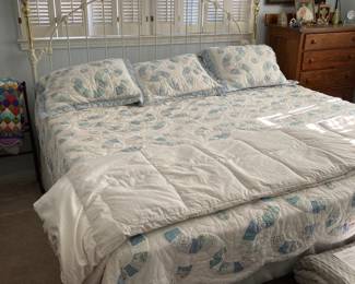 king iron bed, mattress and springs, wedding ring quilt, pine chest, antique mirror