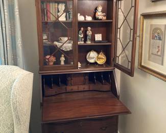 serpentine front, claw foot drop-front secretary with bookcase, has key