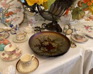 carnival glass, teacups and saucers, salts and peppers, etc. 