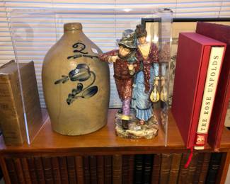 Jug with blue flourish as a crack, figure next to it is majolica