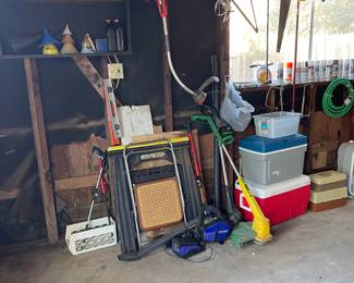 full garage... saws, weedeater, tackle boxes, box fans, drain snakes