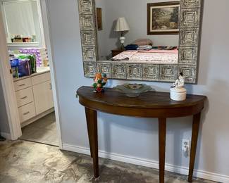 Mirror and half-moon table