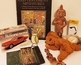vintage collectibles: 1966 Mustang model (bags unopened), Old Testament Miniatures coffee table book, Gund stuffed puppy, drafting tools, copper belt and Mexican fertility god.