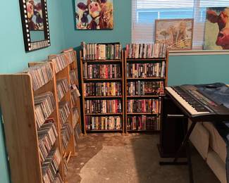 CDs, DVDs VHS and keyboard with stand