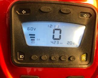 CLOSE UP VIEW OF DIGITAL DASHBOARD OF THIS ELECTRIC E-WHEELS EW-52 4 WHEEL SCOOTER WORKS VERY WELL WITH NEWER BATTERIES