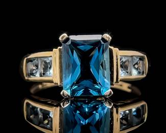 Emerald Cut Blue Topaz & White Topaz Channel Cathedral Ring in 14k Yellow Gold