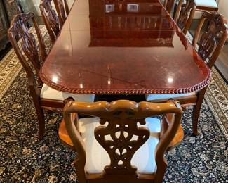 Now $1500 - Was $3000 Carved Chippendale-style Mahogany dining table with 10 carved chairs                                                                                               table: 77" long plus two 18.5" leaves = total length 114"                            