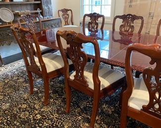 Now $1500 - Was $3000 Carved Chippendale-style Mahogany dining table with 10 carved chairs                                                                                               table: 77" long plus two 18.5" leaves = total length 114"                            