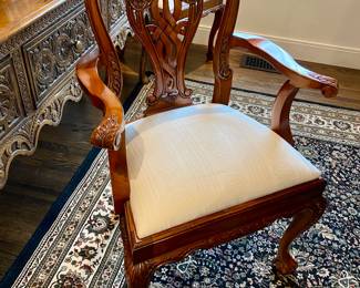 Now $1500 - Was $3000 Carved Chippendale-style Mahogany dining table with 10 carved chairs                                                                                               table: 77" long plus two 18.5" leaves = total length 114"                             