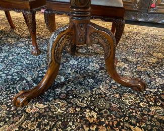 Now $1500 - Was $3000 Carved Chippendale-style Mahogany dining table with 10 carved chairs                                                                                               table: 77" long plus two 18.5" leaves = total length 114"                            