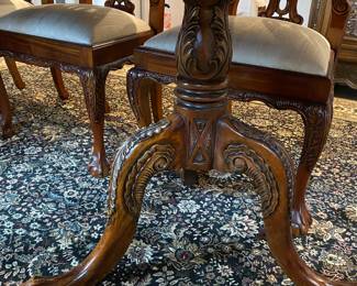 Now $1500 - Was $3000 Carved Chippendale-style Mahogany dining table with 10 carved chairs                                                                                               table: 77" long plus two 18.5" leaves = total length 114"                           