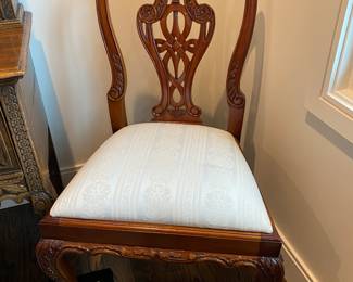 Now $1500 - Was $3000 Carved Chippendale-style Mahogany dining table with 10 carved chairs                                                                                               table: 77" long plus two 18.5" leaves = total length 114"                           