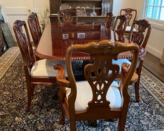 Now $1500 - Was $3000 Carved Chippendale-style Mahogany dining table with 10 carved chairs                                                                                               table: 77" long plus two 18.5" leaves = total length 114"                         